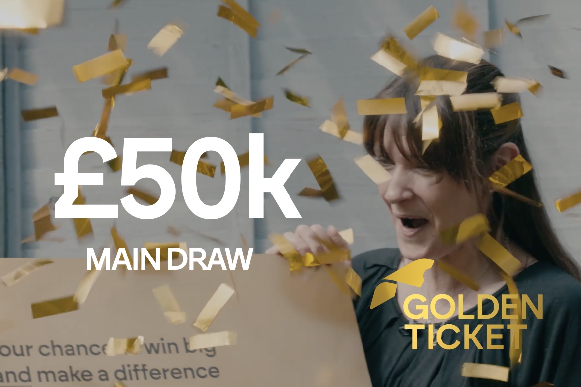Lady holding large cheque with confetti. White text stating £50k main draw