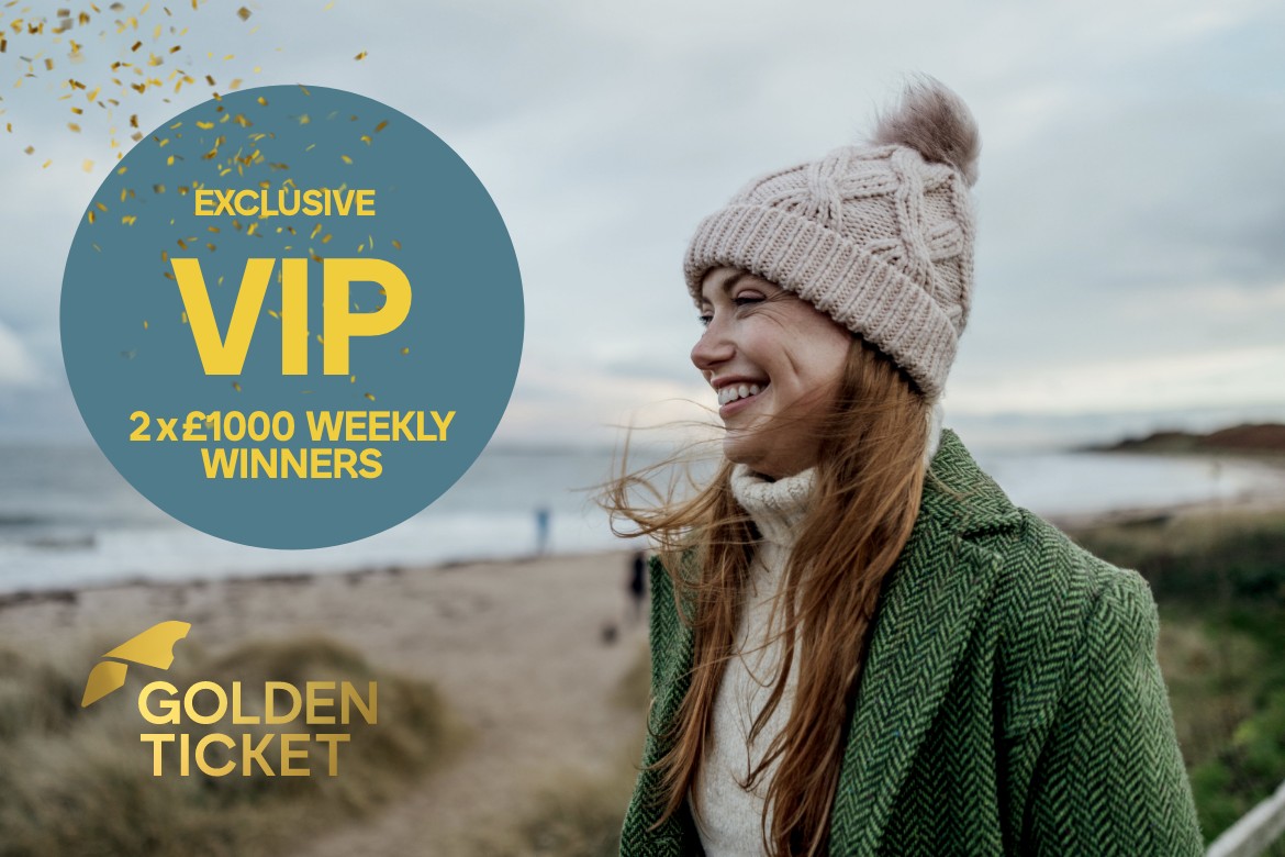 A joyful woman in a winter hat and green coat smiling by the beach with a 'VIP Exclusive' offer overlay.
